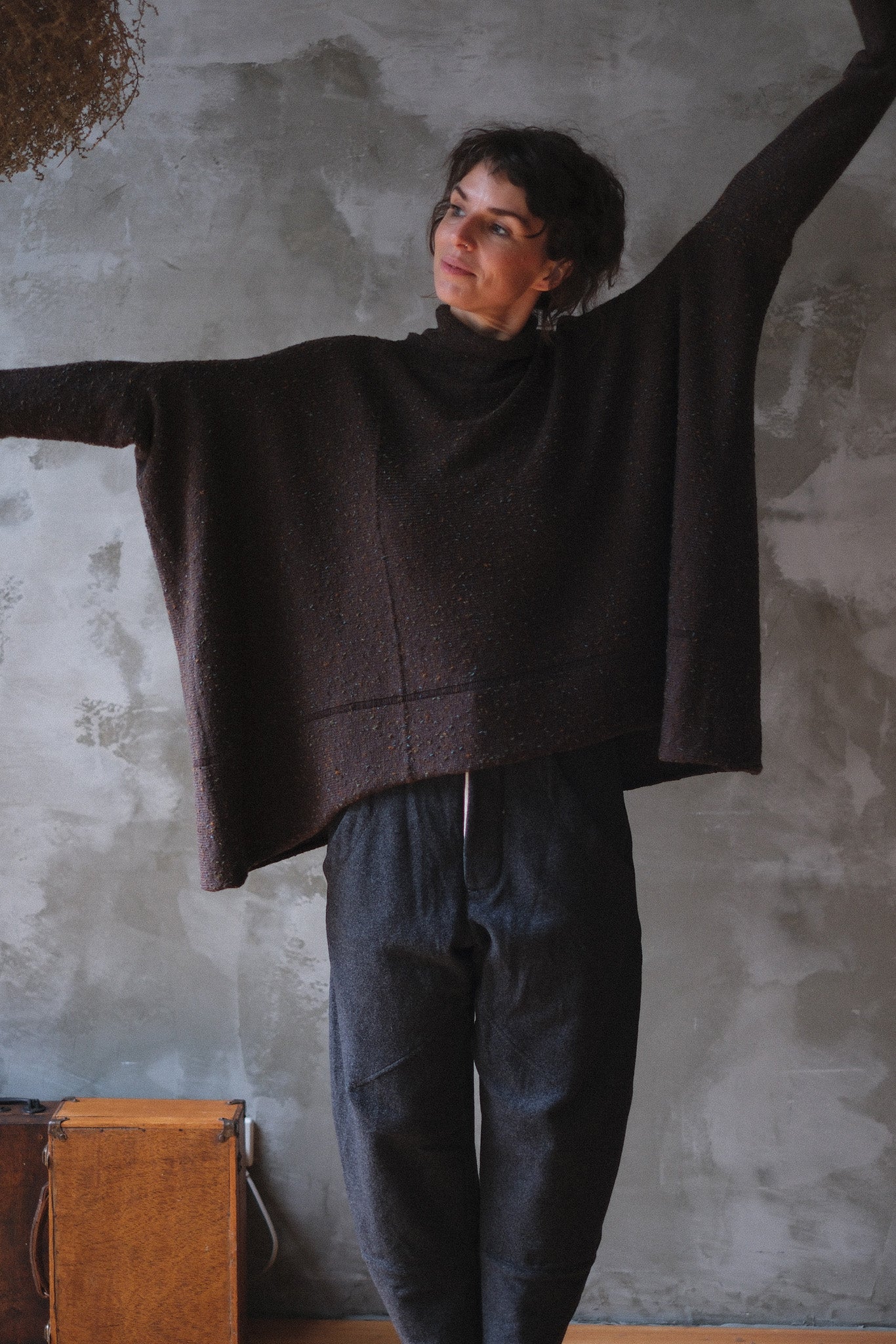 Model wears brown flecked jumper, made from superfine merino wool, designed and made in Melbourne by Wendy Voon knits.