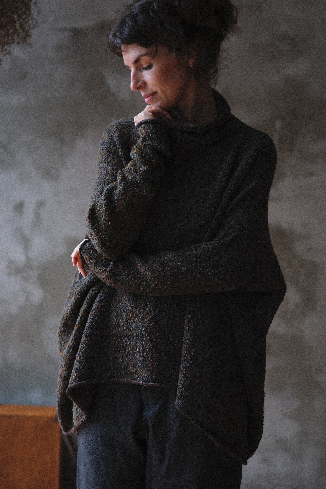 Model wears brown flecked jumper inside out, made from superfine merino wool, designed and made in Melbourne by Wendy Voon knits.