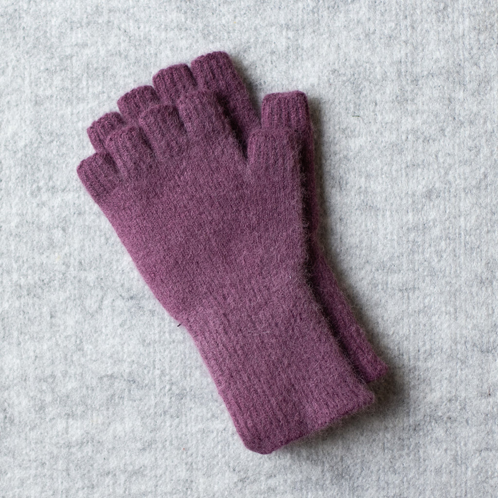Picture of medium length fingerless gloves made from angorra and lambswool in a mauve colourway