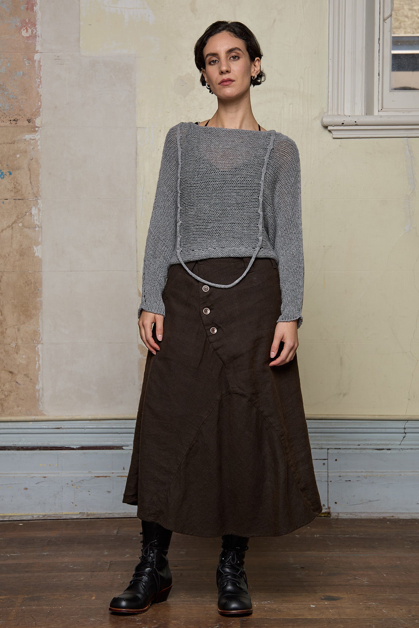 3/4 view of loose cord knit batwing in soft grey, designed by Wendy Voon knits and made in Melbourne.