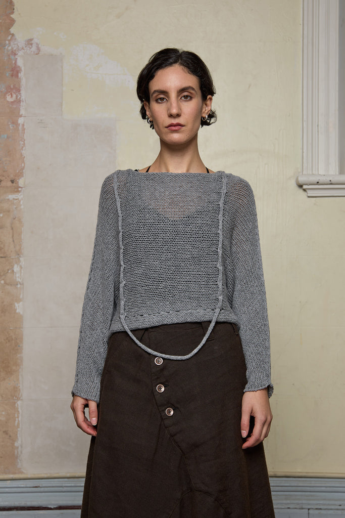 3/4 view of loose cord knit batwing in soft grey, designed by Wendy Voon knits and made in Melbourne.