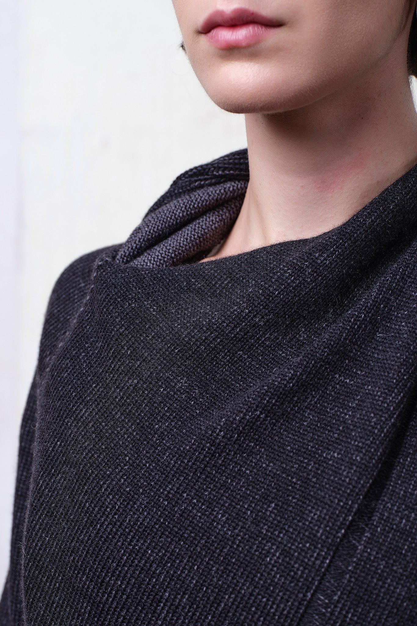Close up fabric view of merino crossover in charcoal and black colourway