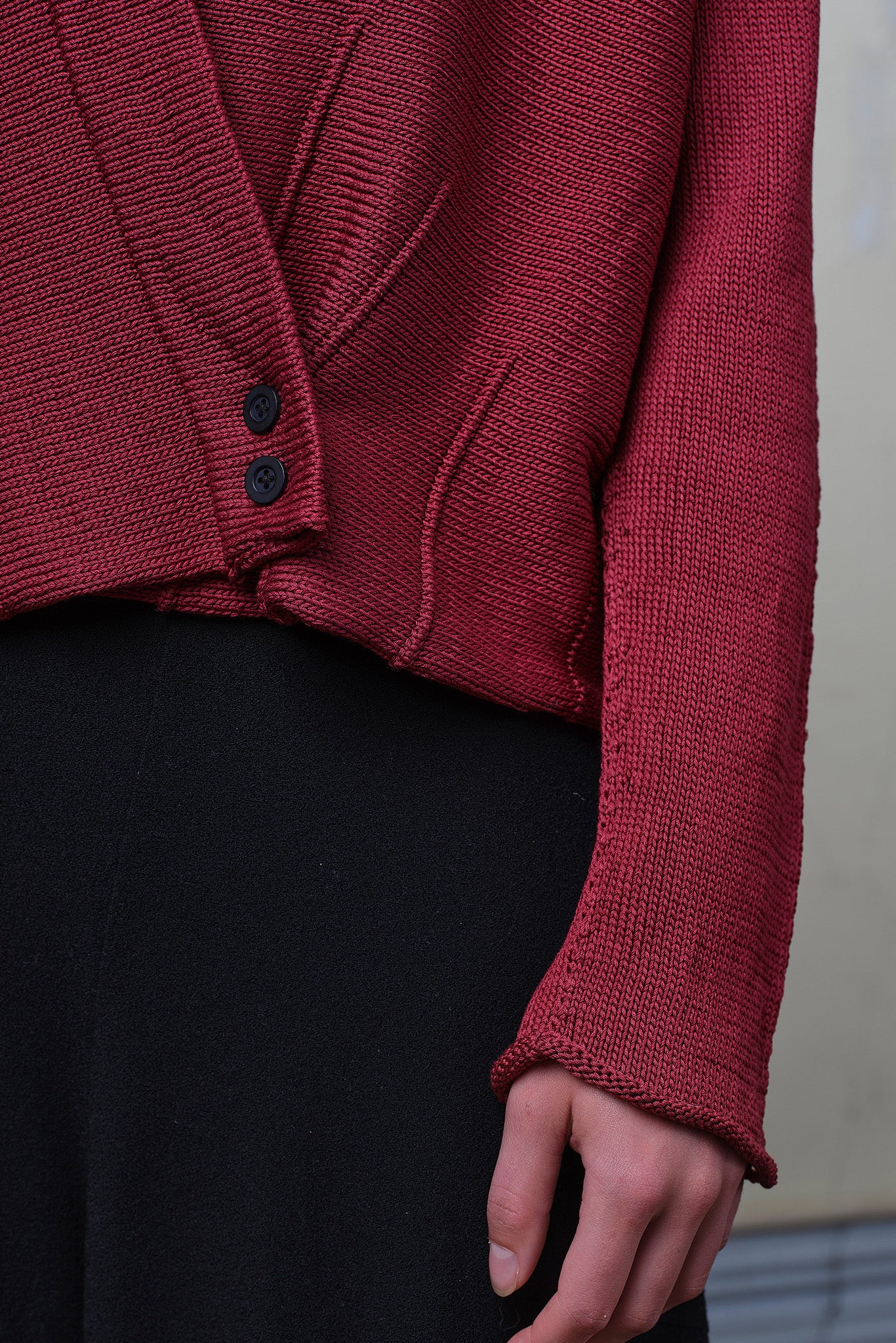 Detail of cotton welted cardi in damask rose colourway