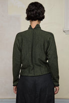 Back view of model wearing welted wool cardigan in army backed with black colourway. Designed and made in Melbourne by Wendy Voon knits.