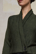 Close up fabric view of welted wool cardigan buttoned up in army backed with black colourway. Designed and made in Melbourne by Wendy Voon knits.