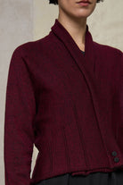 Close up fabric view of welted wool cardigan in burgundy backed with black colourway. Designed and made in Melbourne by Wendy Voon knits.