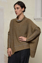 Front view of model wearing a wool boxed shaped jumper in mustard backed with grey merino wool, designed and made in Melbourne by Wendy Voon knits.