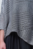 Close up fabric view of linen/cotton tunic in silver grey backed with black colourway