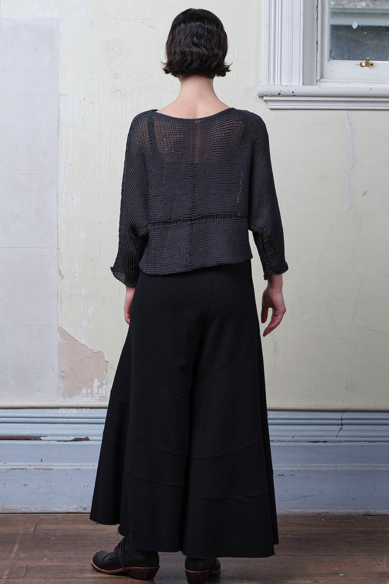 Back view of Cotton Batwing  in slate colourway, featuring large stitch details,  designed by Wendy Voon knits.