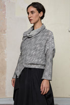 Side profile view of a alpaca/wool/cotton variegated  bias cut jumper in a winter melange colourway, a designed by Wendy Voon and made in Melbourne.