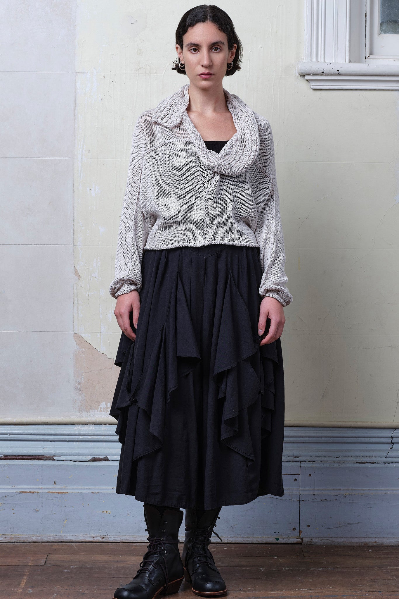 Model wears pearl coloured knitted back scoop jumper in a cotton/linen blend. Designed and knitted in Melbourne by Wendy Voon knits.