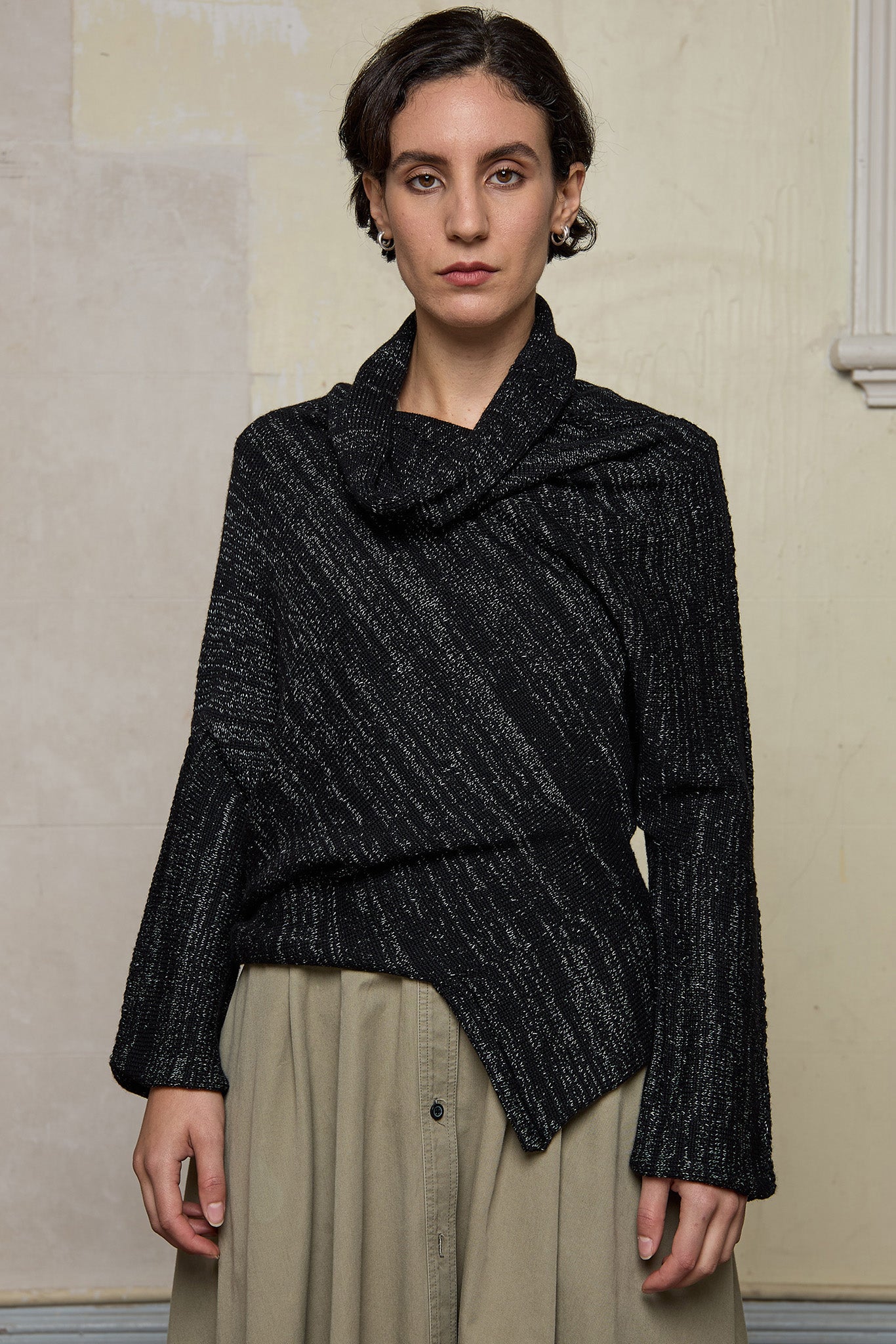 Front view of Bias jumper, a design by Wendy Voon knits in a black flecked with white merino wool and linen/cotton blend fabric.