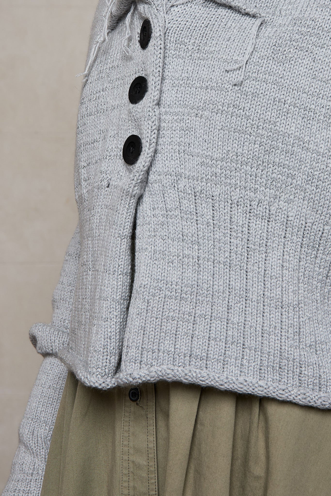 Close up fabric view of off white superfine merino wool ruched cardi,  designed and made by Wendy Voon knits.