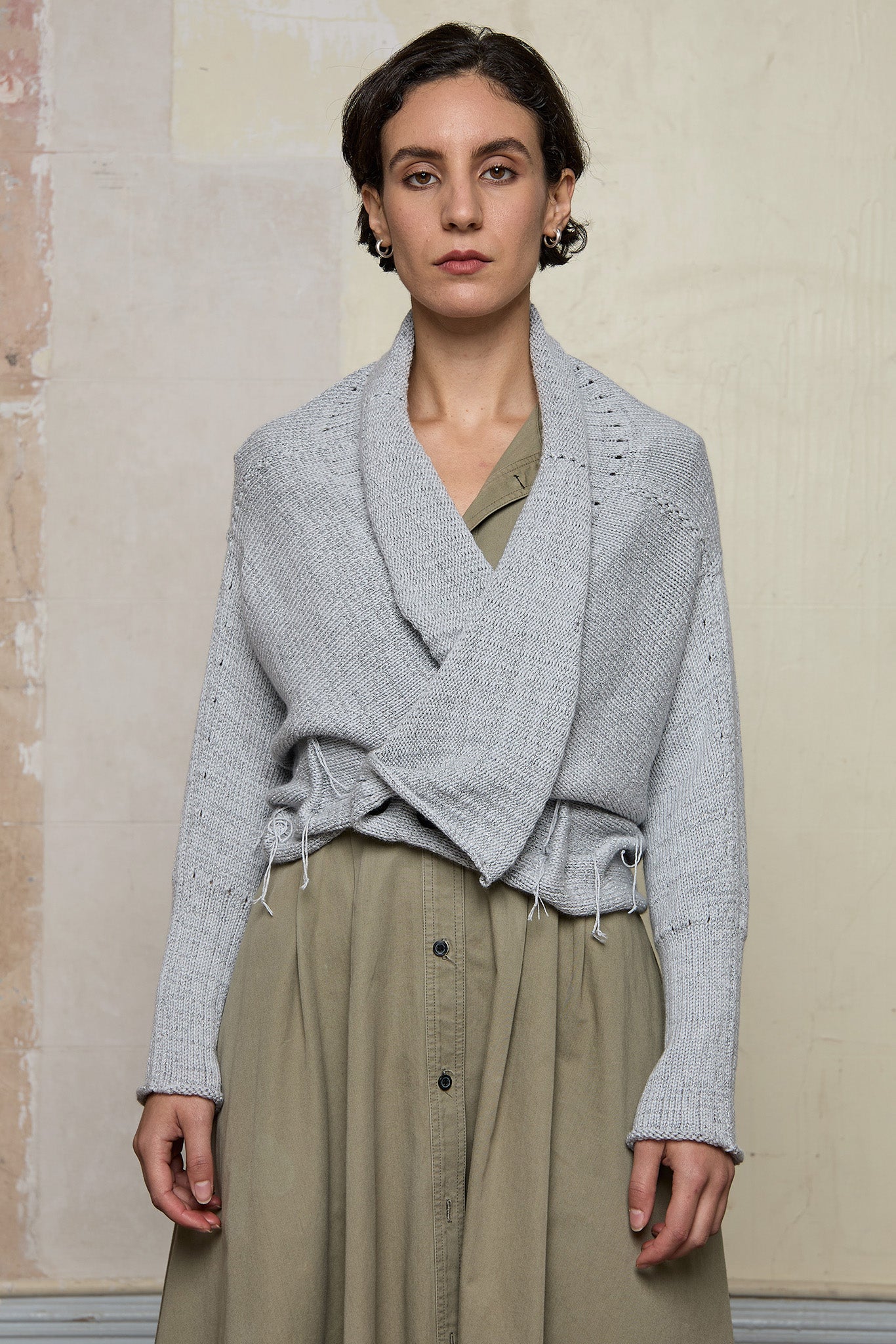 Front view of off white superfine merino wool ruched cardi, worn upside down.  Designed and made by Wendy Voon knits.