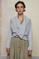 Front view of off white superfine merino wool ruched cardi, worn upside down.  Designed and made by Wendy Voon knits.
