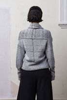 Model wears cotton and superfine merino ruched cardigan in white, grey and black melange colourway. Designed and knitted in Melbourne by Wendy Voon Knits