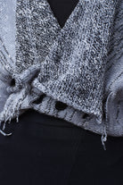 Close up fabric detail of cotton and superfine merino ruched cardigan in white, grey and black melange colourway. Designed and knitted in Melbourne by Wendy Voon Knits