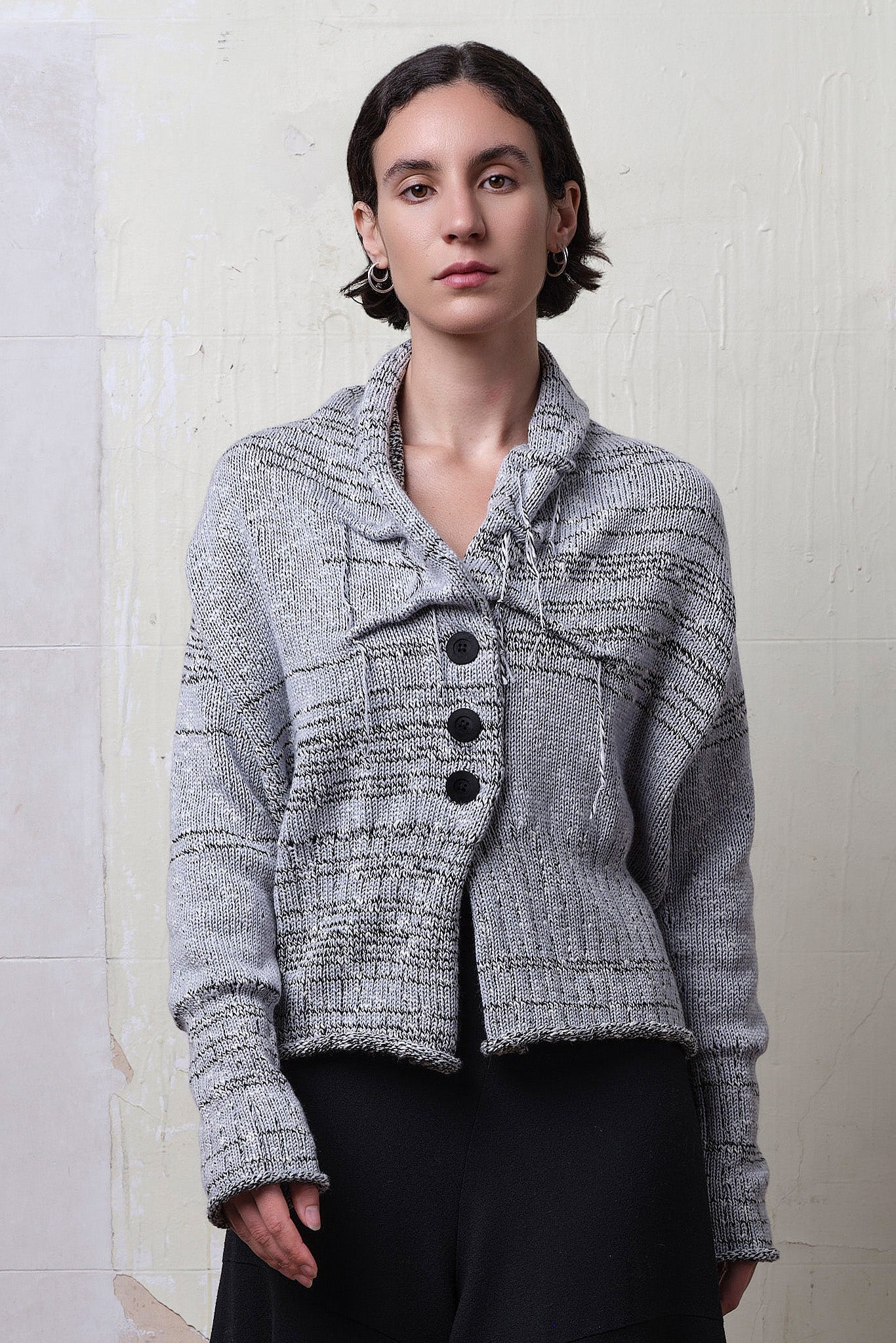 Model wears cotton and superfine merino ruched cardigan in white, grey and black melange colourway. Designed and knitted in Melbourne by Wendy Voon Knits