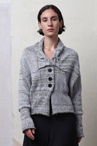 Model wears cotton and superfine merino ruched cardigan in white, grey and black melange colourway. Designed and knitted in Melbourne by Wendy Voon Knits