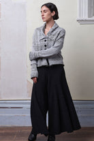Model wears cotton and superfine merino ruched cardigan in white, grey and black melange colourway. Designed and knitted in Melbourne by Wendy Voon Knits