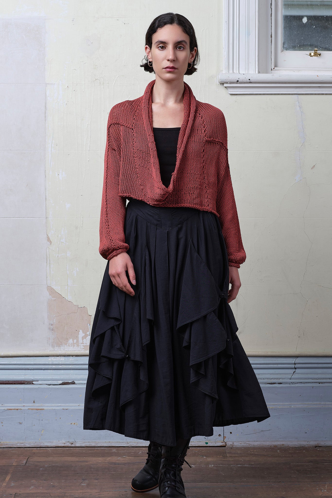 Model wears coral cotton cropped jumper. Designed and knitted in Melbourne by Wendy Voon knits