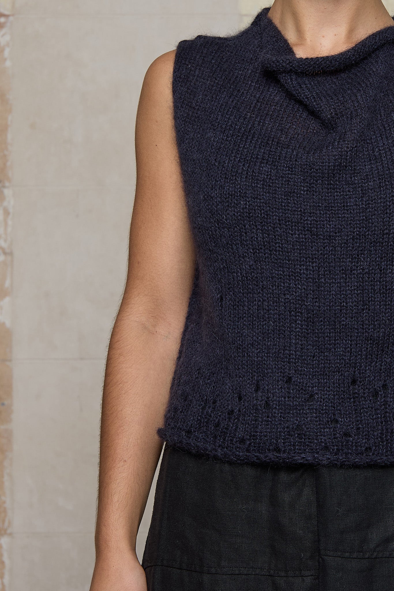 Close up of lacehole detail on super lush knitted vest in midnight colourway, designed and knitted in Melbourne by Wendy Voon knits