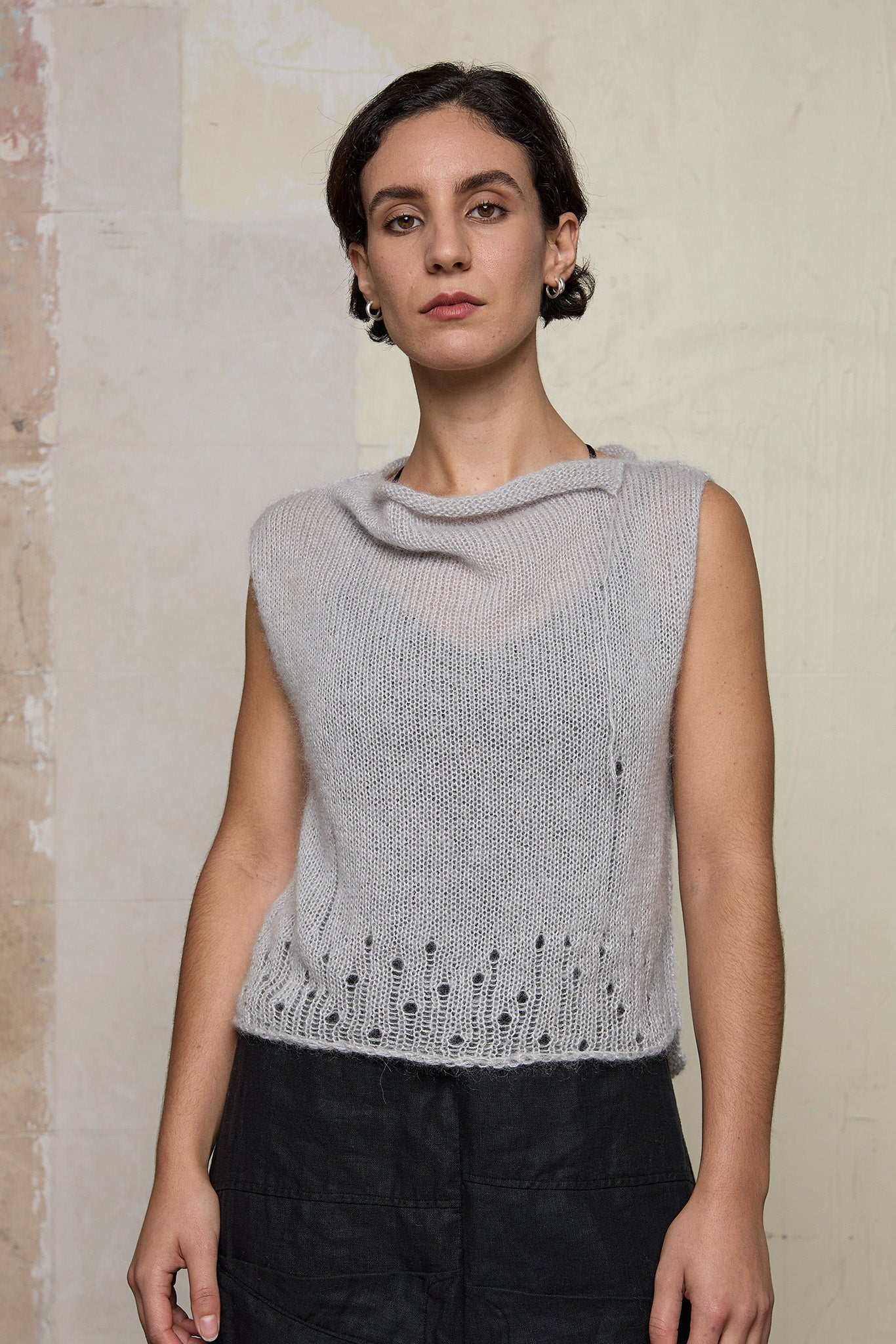 Front view of model wearing super lush knitted vest in soft grey colourway, designed and knitted in Melbourne by Wendy Voon knits