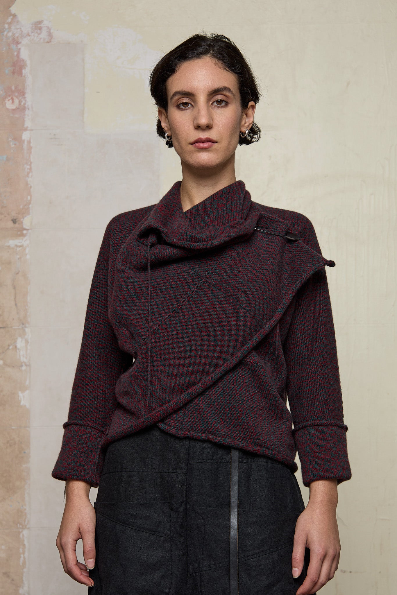 Front view of knitted wool cropped jacket in red and teal melange, designed by Wendy Voon, knitted in Melbourne.