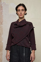 Front view of knitted wool cropped jacket in red and teal melange, designed by Wendy Voon, knitted in Melbourne.