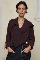 Front view of knitted wool cropped jacket in red and teal melange, designed by Wendy Voon, knitted in Melbourne.