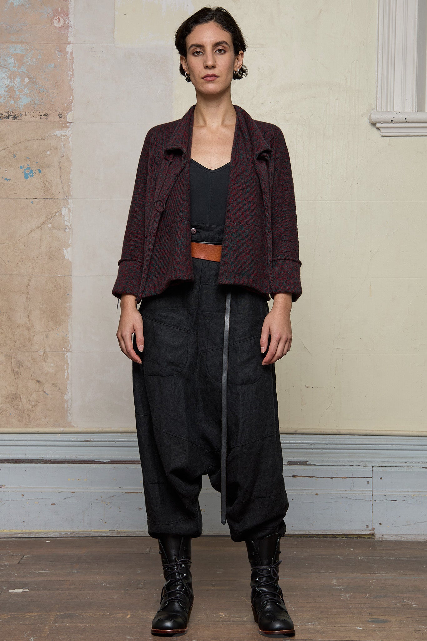 Front view of knitted wool cropped jacket in red and teal melange, designed by Wendy Voon, knitted in Melbourne.