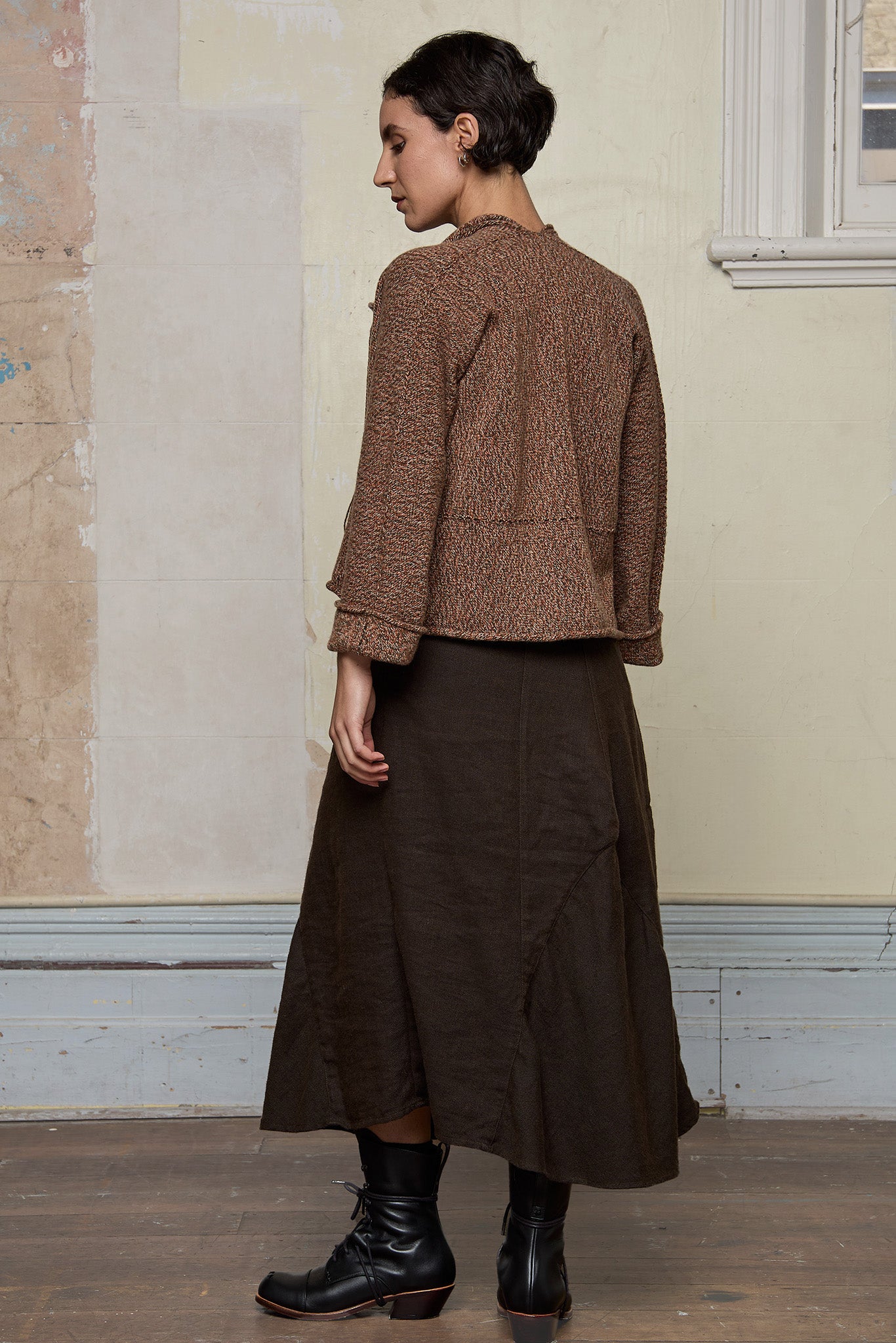 Back view of knitted wool cropped jacket in rust, army and cream melange, designed by Wendy Voon, knitted in Melbourne.