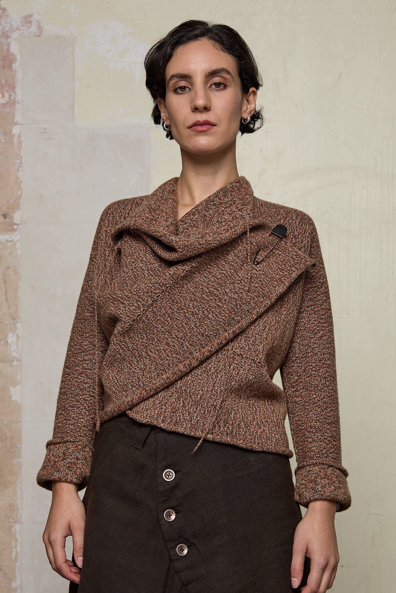 Front view of knitted wool cropped jacket in rust, army and cream melange, designed by Wendy Voon, knitted in Melbourne.