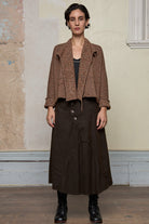 Front view of knitted wool cropped jacket in rust, army and cream melange, designed by Wendy Voon, knitted in Melbourne.