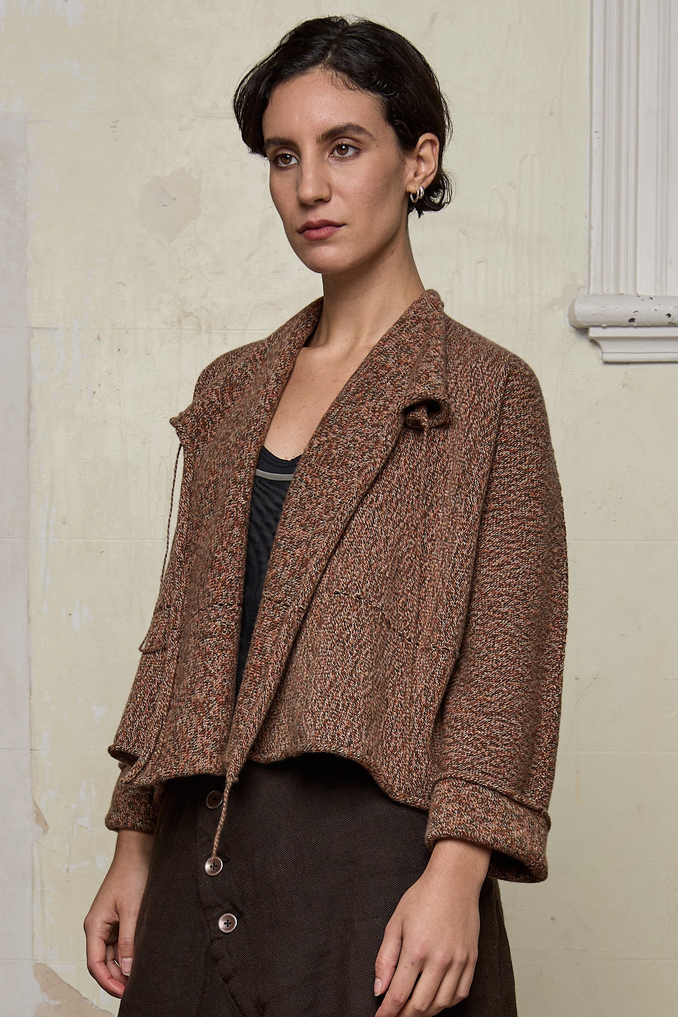 Front view of knitted wool cropped jacket in rust, army and cream melange, designed by Wendy Voon, knitted in Melbourne.