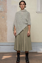 Full view of model wearing mohair cocoon, an asymmetric poncho in a white flecked colourway