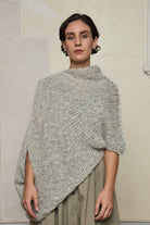 Front view of model wearing mohair cocoon, an asymmetric poncho in a white flecked colourway