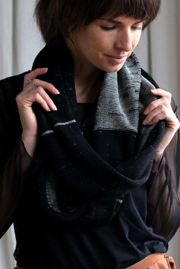 Black and white two toned infinity scarf worn looped, designed and made by Wendy Voon knits