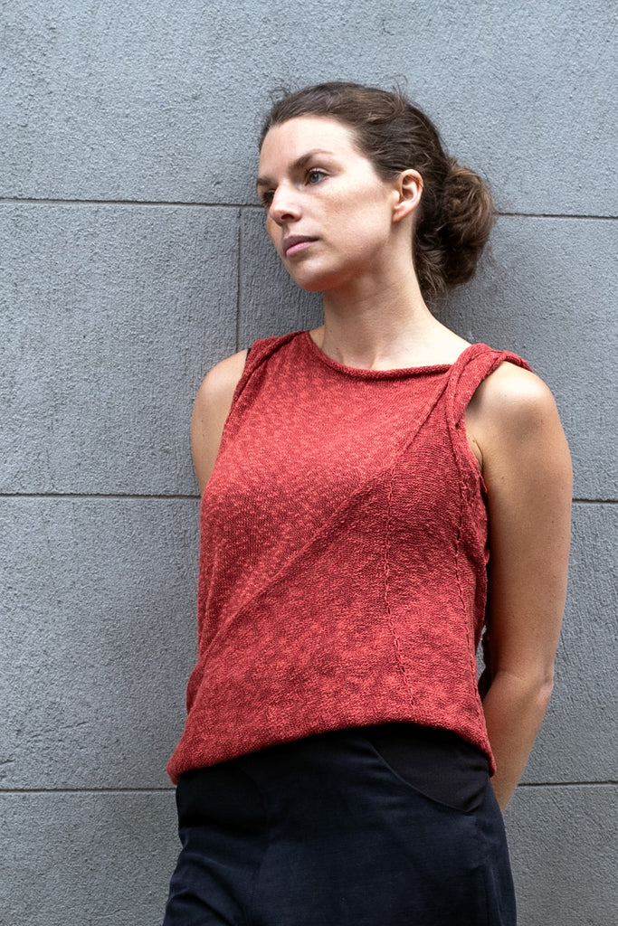 Front view of Double Up Top design by Wendy Voon knits in coral linen cotton, loop worn long and double layer front detail