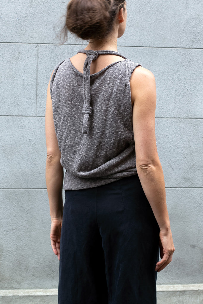 Back view of Double Up Top design by Wendy Voon knits in taupe linen cotton, loop worn knotted and around the neck