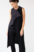 Front full length view of Two Toned Asymmetric Longline vest design by Wendy Voon knits in charcoal and black merino wool