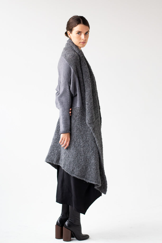 Side front view of Logical Progression Coat by Wendy Voon in storm grey merino and alpaca, worn long and open
