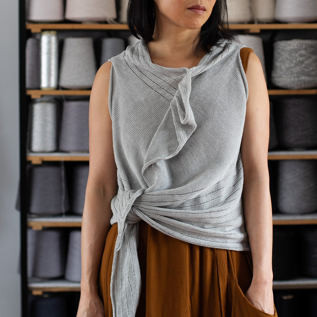 Model wears knitted laddered linen vest, in silver grey colourway, designed and knitted in Melbourne by Wendy Voon knits