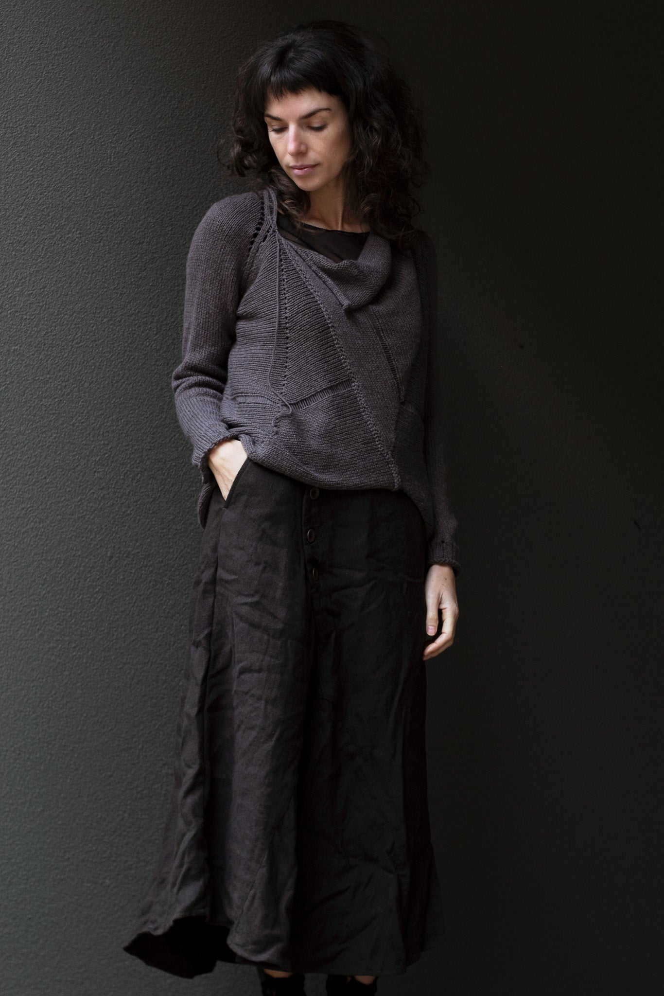 Front view of taupe superfine merino wool/polyamide jumper, designed by Wendy Voon knits, made in Melbourne.  Jumper features triangular panels at front with loose threads left as design feature