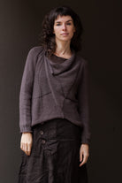 Front view of taupe superfine merino wool/polyamide jumper, designed by Wendy Voon knits, made in Melbourne.  Jumper features triangular panels at front with loose threads left as design feature