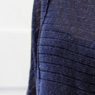 Front detail of Linen Laddered Batwing design by Wendy Voon knits in navy flecked linen and merino wool, showing fabric detail
