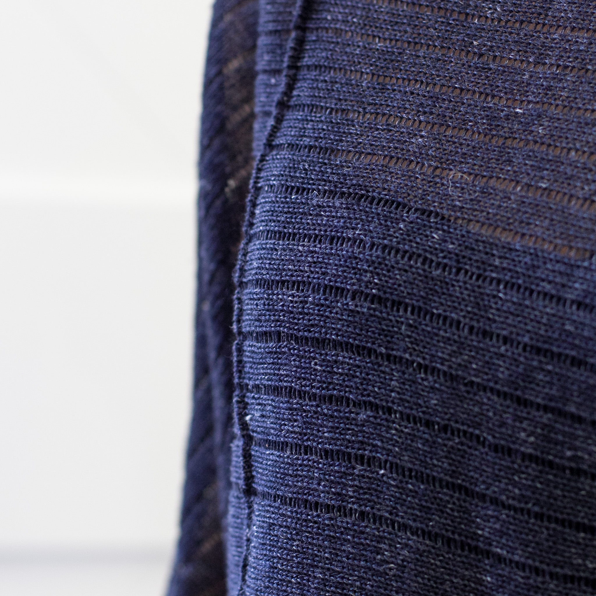 Front detail of Linen Laddered Batwing design by Wendy Voon knits in navy flecked linen and merino wool, showing fabric detail