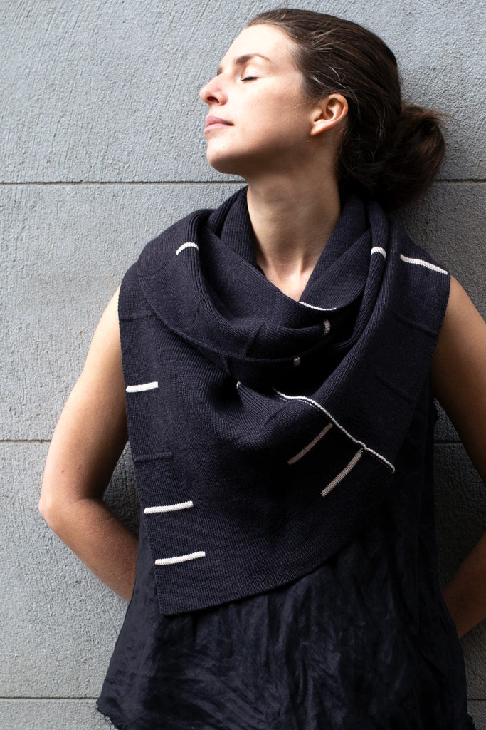 Front view of Linework Scarf design by Wendy Voon in charcoal merino with cream stripes, worn double looped infinity style