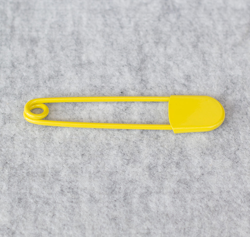 Giant safety pin in yellow