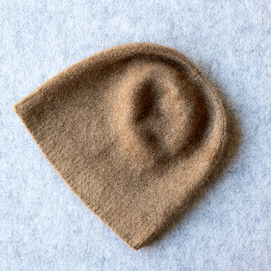 Camel coloured knitted beanie made from merino wool, possum and silk